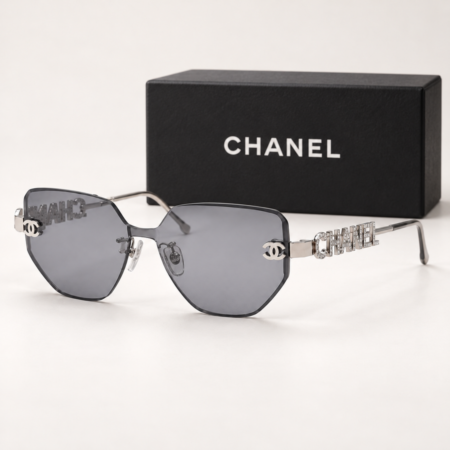 CC Silver Grey Rimless Geometric Sunglasses — front-left view with brand box