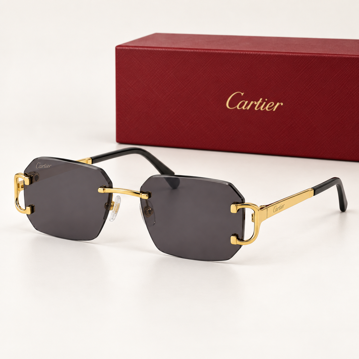 CR Signature C Geometric Rimless Sunglasses — front-left view with brand box