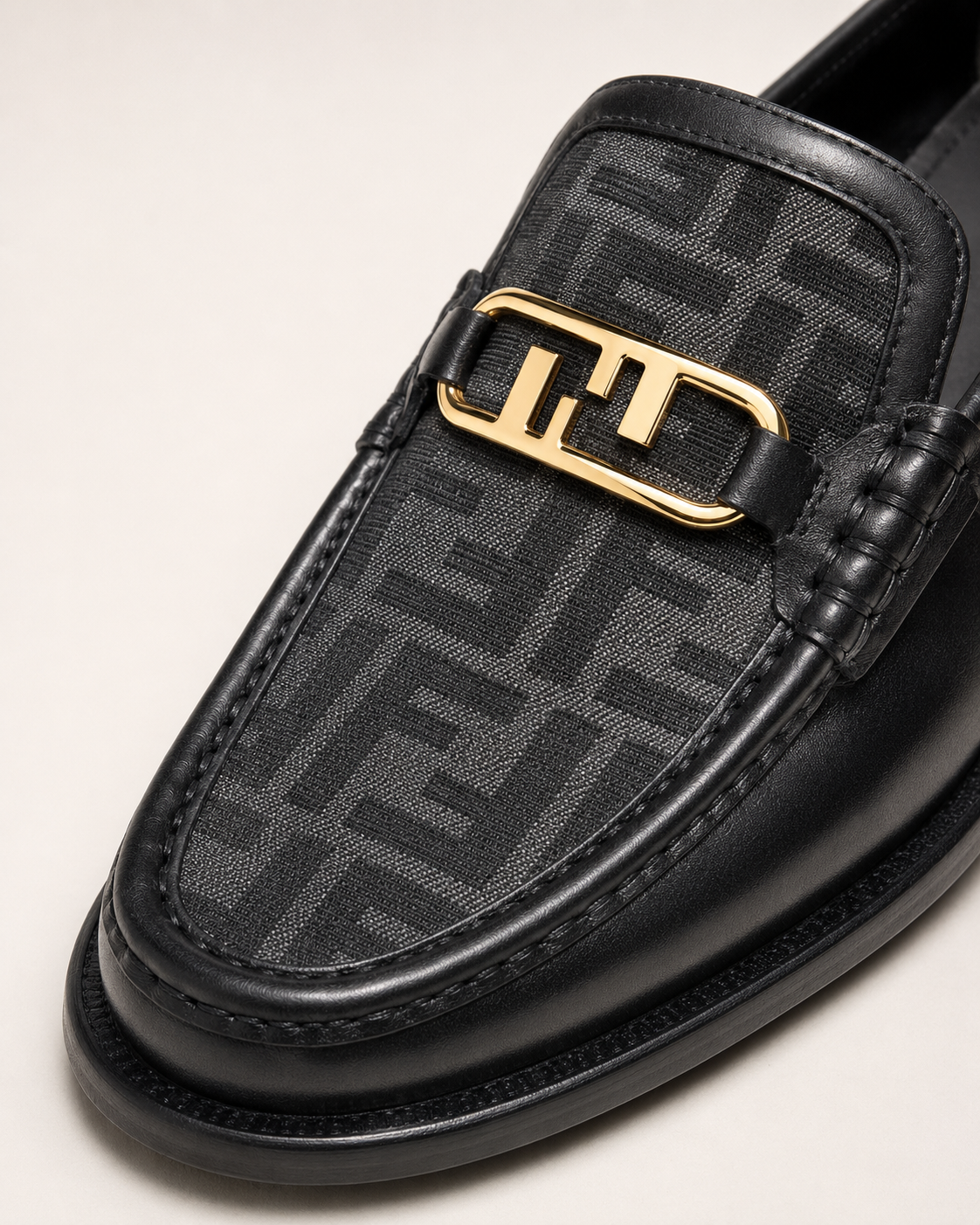 Men’s Black patterned Gold-Buckle Loafers - macro detail of luxury men's loafer