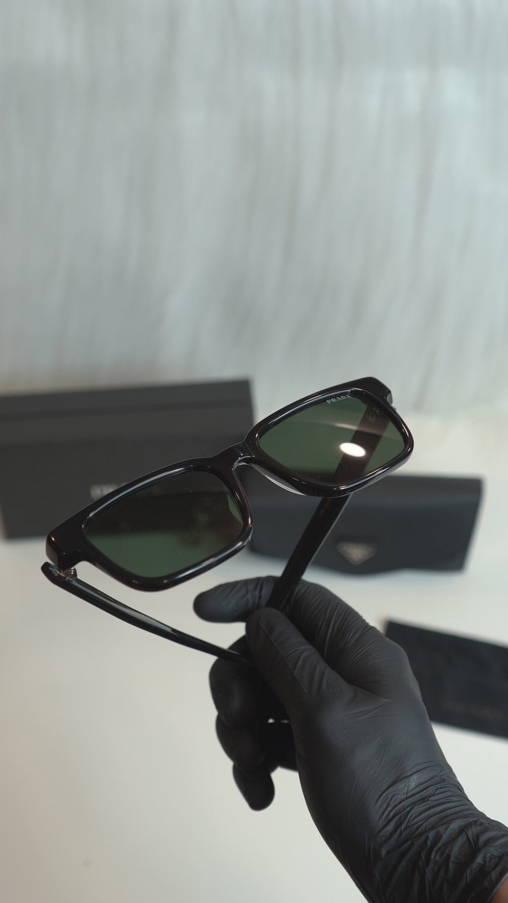 prd pr d02e black green lens sunglasses — upright product details, no audio